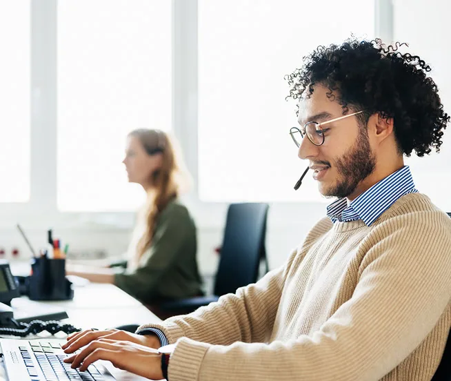 Man talking to customer using headset