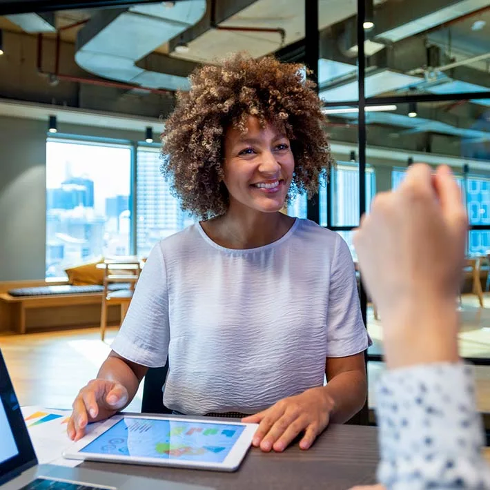 Female discussing data with a colleague