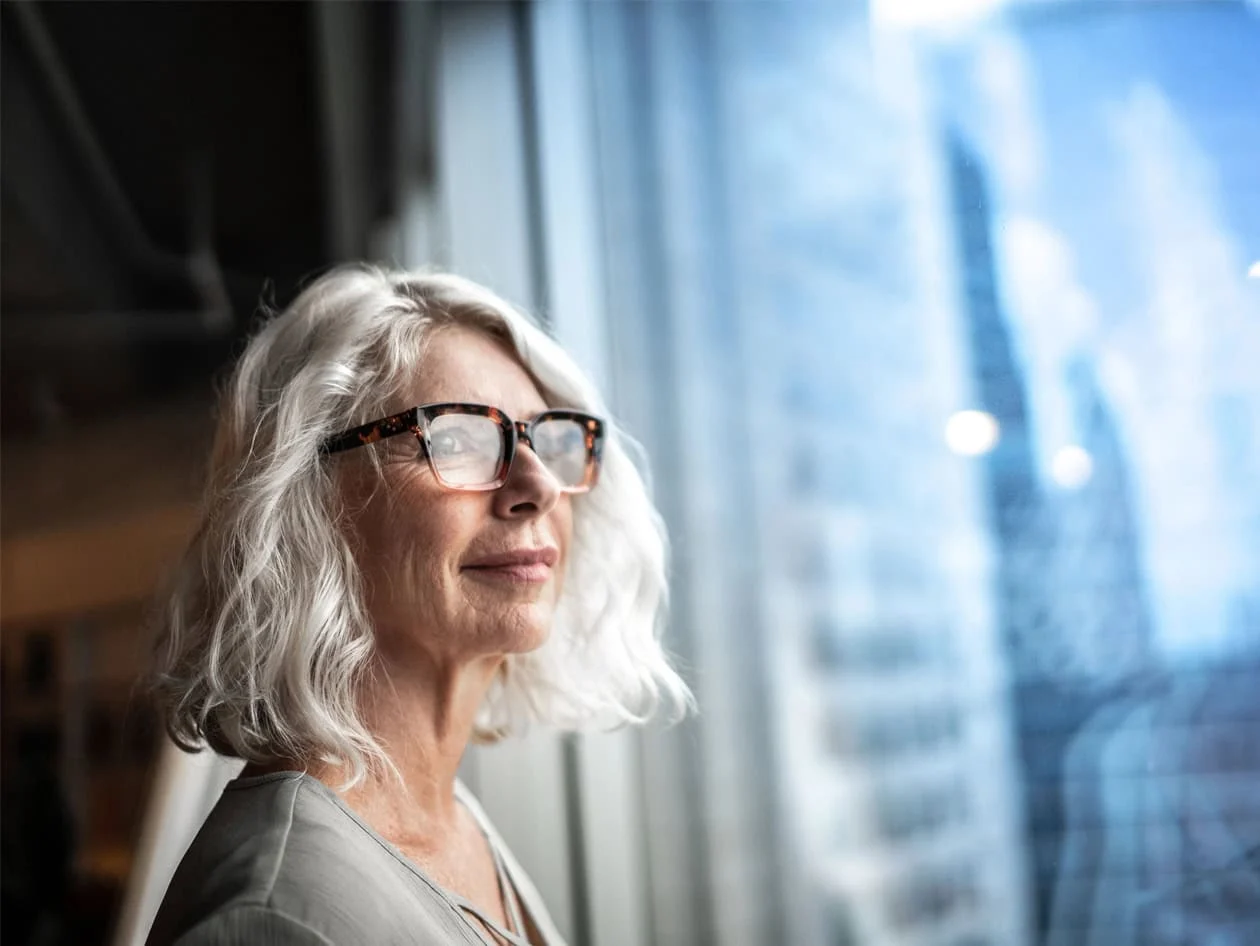 Lady looking outside the window