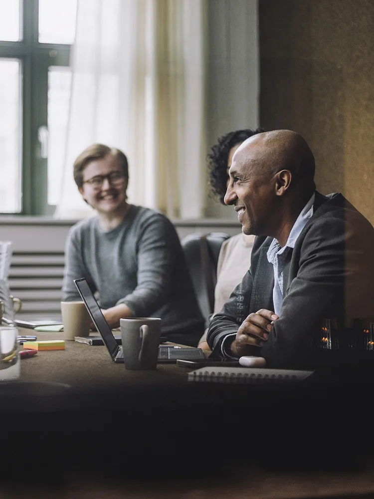 Diverse professional sitting at a conference table