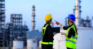 Photo showing chemical engineering workers discussing process safety