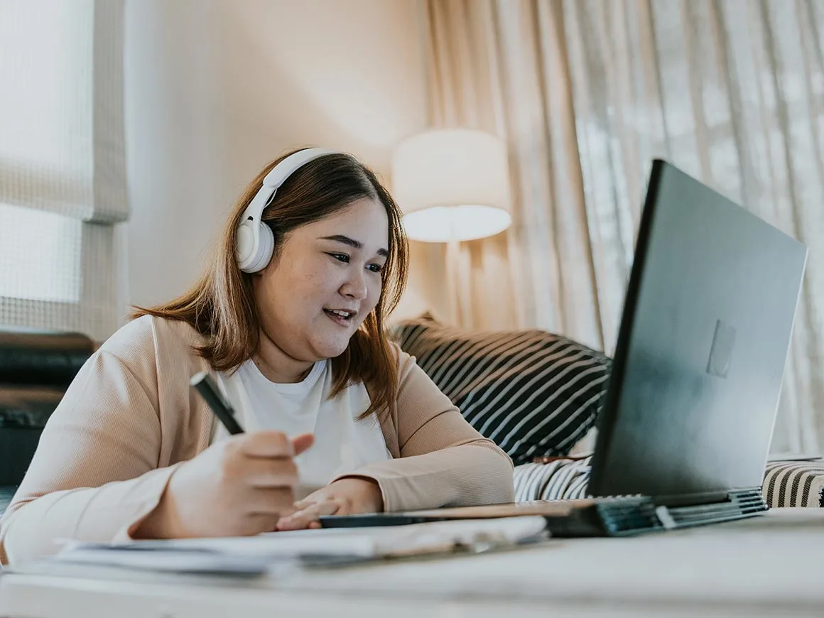 Asian woman studying her first master's degree class, enjoy and happy to see her classmates